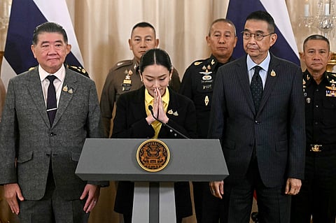 THAI Prime Minister Paetongtarn Shinawatra (center) gestures at a press conference next to Deputy Prime Minister and Defense Minister Phumtham Wechayachai, Foreign Minister Maris Sangiampongsa, Armed Forces commander Pana Klaewplodthuk, chief of the Defense Forces Songwit Noonpackdee and commissioner-general of the Royal Thai Police Kitrat Phanphet at Government House in Bangkok on 19 June 2025.