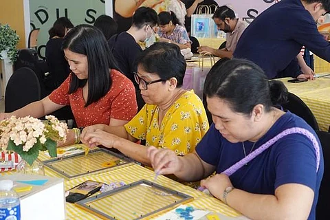 PARTICIPANTS engage in the Pressed with Love workshop at Book Nook SM Podium, learning the delicate art of flower pressing and embracing mindful, nature-inspired creativity.