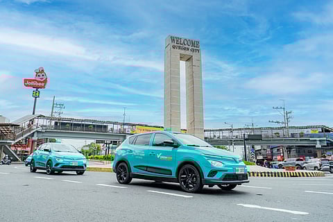 VINFAST Nerio Green taxis roll past the Quezon City welcome marker as Green GSM officially hits the streets.