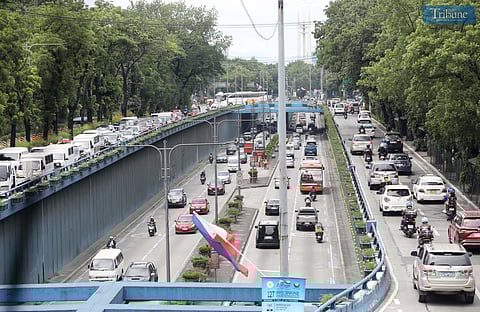 MOTORISTS pass through Quezon Avenue as construction for the Metro Manila Subway and plans for a new bus lane move forward.