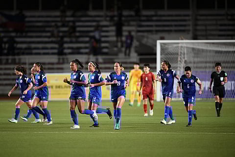 This photo taken on July 15, 2022 shows members of the Philippine women's footbal team on the pitch as they play against Vietnam in the women's Asian Footbal Federation semi-final match at Rizal memorial stadium in Manila. In a country obsessed with beauty pageants, basketball and boxing, the Philippines women's team hope to ignite interest in football when they make the nation's World Cup debut.