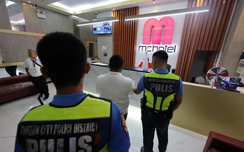 Authorities at the MC Hotel in Barangay Novaliches Proper carry out the closure order of the Quezon City government on Thursday (June 19, 2025). The establishment was shut down for allegedly allowing minors to check in and serving them alcoholic drinks.