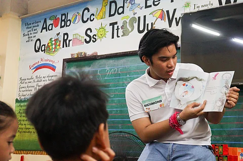 Generously giving back Scholars embody community spirit by actively participating in outreach initiatives like Brigada Eskwela, helping young students prepare for a new school year through a reading session.