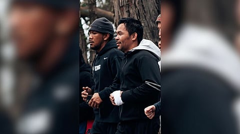 Up and coming fighters like Tokyo Olympics bronze medalist Eumir Marcial inject a youthful vibe to the training camp of Manny Pacquiao (right), who makes it a two-way street by providing his knowledge of the sport.