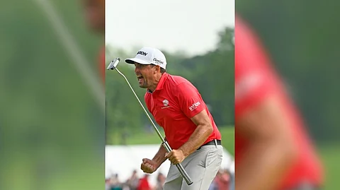 KEEGAN Murray roars after nailing a tension-packed birdie putt to win the Travelers Championship title.