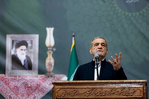 This handout picture provided by the Iranian presidency shows Iran's President Masoud Pezeshkian giving an address on the anniversary of the death of the country's former supreme leader Ayatollah Ruhollah Khomeini at the latter's mausoleum in Tehran on June 3, 2025.