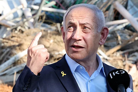 Israel's Prime Minister Benjamin Netanyahu gives a statement during a visit to the site of the Weizmann Institute of Science, which was hit by an Iranian missile barrage, in the central city of Rehovot on 20 June 2025.