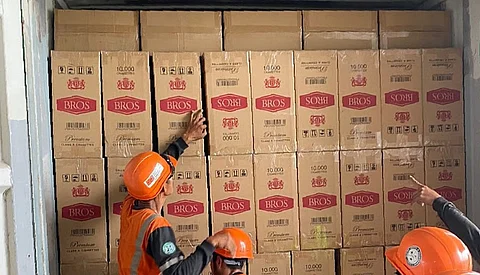 Officials from the Department of Agriculture join members of the Philippine National Police in inspecting onions sold at Paco Market in Manila as the DA intensifies its crackdown on agricultural smuggling under the new Anti-Agricultural Economic Sabotage Act.