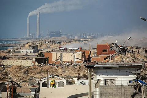 A convoy of trucks carrying aid drives after entering the Gaza Strip from the Israeli-controlled Zikim crossing, west of Beit Lahia in the north of the besieged Palestinian territory on June 25, 2025. Rights groups say Gaza and its population of more than two million face famine-like conditions due to Israeli restrictions, with near-daily deaths of people queuing for food aid.
