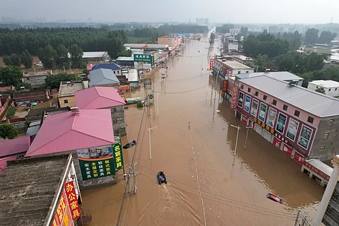 Over 80K flee floods in southwest China