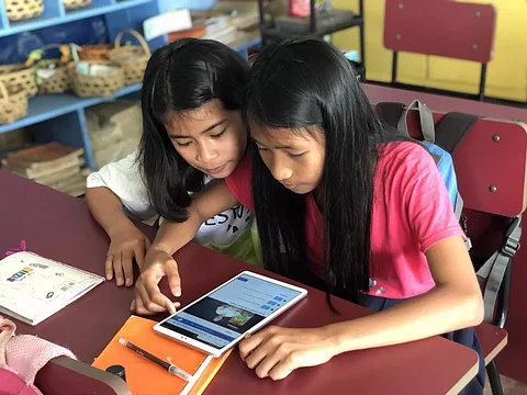 ELEMENTARY students of Aurora province share a tablet during online learning.