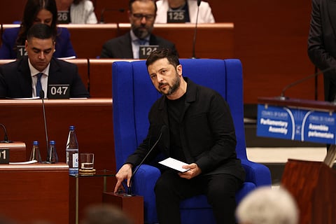 Ukraine's President Volodymyr Zelensky looks on as he addresses members of the Parliamentary Assembly of the Council of Europe following the signing of an agreement for establishing a special tribunal to try top officials responsible for Russia's invasion of Ukraine at the Council of Europe in Strasbourg, eastern France, on June 25, 2025.