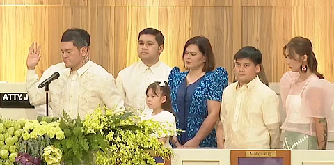DAVAO City Vice Mayor Sebastian ‘Baste’ Duterte takes his oath of office before Associate Justice Jill Rose Jaugan-Lo during inaugural rites on Friday. With him are Vice President Sara Duterte, their mother Elizabeth Zimmerman (partly covered), and family members including 1st District Councilor Rigo Duterte.