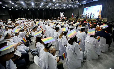Pride in every step Three hundred LGBTQIA+ graduates prepare to cross the stage during graduation rites held at the MICE Building, Quezon City Hall. Now in its second year, the ceremony honors the right to self-expression — celebrating students who marched in garments true to their identity.