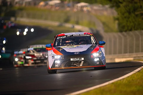 HYUNDAI’S ELANTRA N TCR cars push through the curves of the Nordschleife in perfect formation.