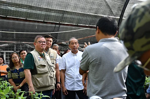 AGRICULTURE Secretary Francisco Tiu Laurel Jr. is joined by Bureau of Plant Industry Director Glenn Panganiban and incoming Los Baños Mayor Neil Andrew Nocon during a tour of the upgraded tissue culture laboratory in Laguna on 26 June. The facility aims to boost crop production through science-based planting materials.