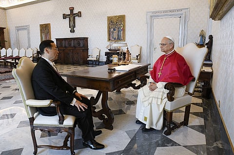 This photo taken and handout on 3 July 2025 by The Vatican Media shows Pope Leo XIV with Anthony Chung-Yi Ho, Taiwan's ambassador to the Holy See on the occasion of the presentation of his Credential Letters to the Pope in The Vatican.