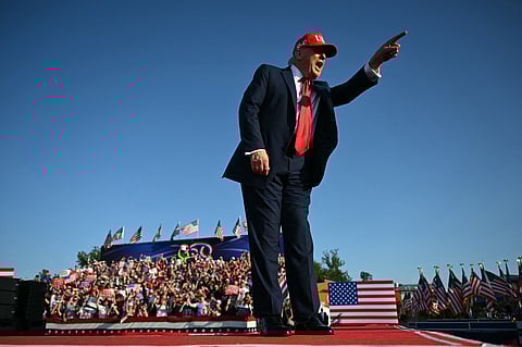 US President Donald Trump gestures as he steps on stage to deliver remarks at the Salute to America Celebration at the Iowa State Fairgrounds in Des Moines on July 3, 2025.