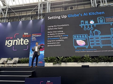 GLOBE'S Chief AI Officer Anton Bonifacio on stage at DTW Ignite 2025, sharing insights on the company's human-centric approach to AI.