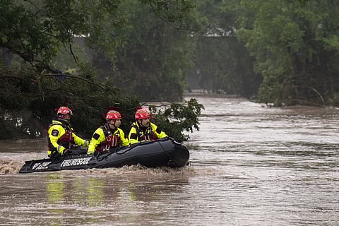 BOERNE Search and Rescue teams navigate upstream in an inflatable boat on the flooded Guadalupe River on July 4, 2025 in Comfort, Texas. Heavy rainfall caused flooding along the Guadalupe River in central Texas with multiple fatalities reported.