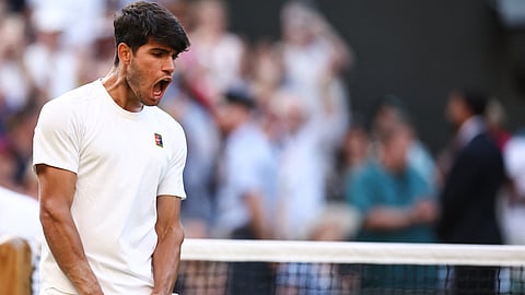 CARLOS Alcaraz celebrates after booking a scary 6-1, 3-6, 6-3, 6-4 win over Jan-Lennard Struff to secure a spot in the Last 16 of the Wimbledon Championships.