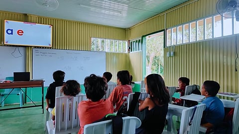 STUDENTS of Datu Saldong Domino Elementary School watch an online alphabet lesson on a digital screen powered by solar electricity in Sitio Tagpangi, Buenavista, Agusan del Norte on 19 June 2025.