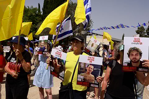 Families and supporters protest calling for action to secure the release of Israeli hostages held captive in the Gaza Strip by Palestinian militants since the 2023 October 7 attacks, outside the prime minister's office in Jerusalem, on July 1, 2025.