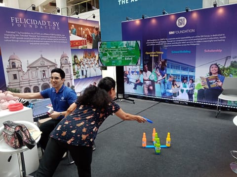 A GUEST plays a ring toss game to win a stuffed toy prize at the booth of the SM Foundation Inc., Henry Sy Foundation and Felicidad T. Sy Foundation in Glorietta Activity Center in Greenbelt, Makati City on 1 July 2025.
