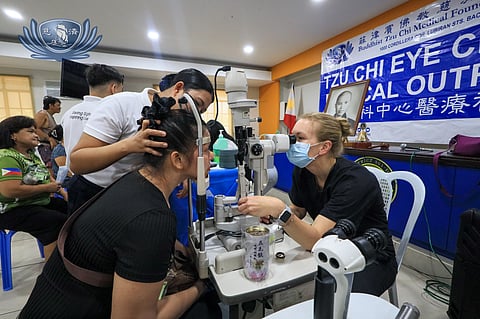 DR. Christine Larsen (right), a glaucoma and cataract specialist from the University of Wisconsin-Madison Department of Visual Sciences, checks a patient at the Tzu Chi Eye Center.