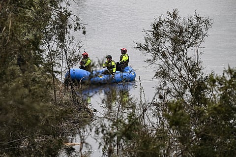 Members of a rescue team look for missing people on the Guadalupe River in Kerrville, Texas, on July 6, 2025, following severe flash flooding that occured during the July 4 holiday weekend. Rescuers in Texas raced against time Sunday to find dozens of missing people, including children, swept away by flash floods that killed at least 78, as forecasters warned of new deluges. Local Texans joined forces with disaster officials to search through the night for the missing, including 27 girls from a riverside Christian summer camp. Texas Governor Greg Abbott said Camp Mystic on the banks of the Guadalupe River, where some 750 girls had been staying when the floodwaters hit, had been "horrendously ravaged in ways unlike I've seen in any natural disaster."