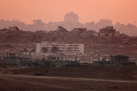 This picture taken from a position on the Israeli border with the Gaza Strip shows destroyed buildings in the besieged Palestinian territory, on July 10, 2025, amid the ongoing war with the Palestinian militant movement Hamas.