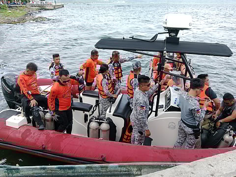 PERSONNEL of the Philippine Coast Guard prepares to conduct technical assessment of Taal Lake to determine the water condition before an actual dive.