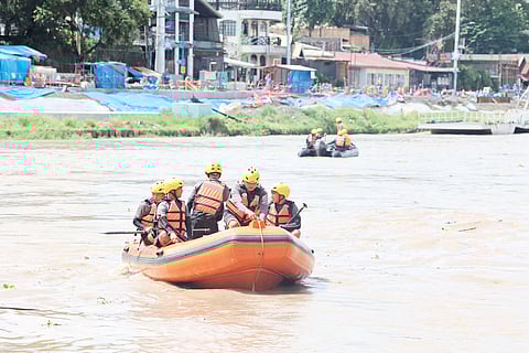 The Philippine Army DRU 525th Combat Engineer Battalion members ride rubber boats as they do a maneuvers along Marikina River. The practice is part of their readiness for disaster deployment and monitoring of equipment.