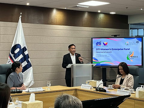 Small Business Corporation president and CEO Robert Bastillo discusses how women entrepreneurs can avail of the Women's Enterprise Fund program, a soft loan specifically meant for them. Trade Secretary Cris Roque (left) listens while Bastillo is discussing the loan program during its formal launch on Thursday at the DTI office in Makati City.