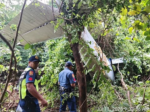 POLICE officers inspect the crashed Cessna plane in Purok 3, CDO Compound in Barangay LDP of Iba, Zambales on July 11, 2025.