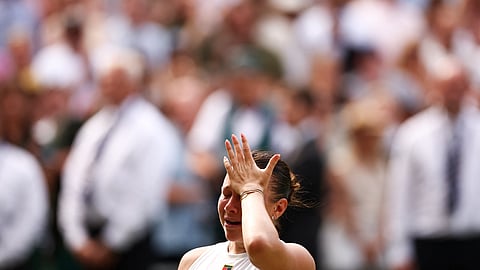 US player Amanda Anisimova speaks and reacts following her defat against Poland's Iga Swiatek at the end of their women's singles final tennis match on the thirteenth day of the 2025 Wimbledon Championships at The All England Lawn Tennis and Croquet Club in Wimbledon, southwest London, on July 12, 2025.