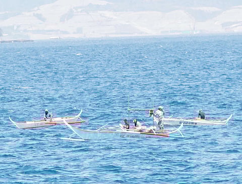 FISHERMEN off Calapan port in Oriental Mindoro.