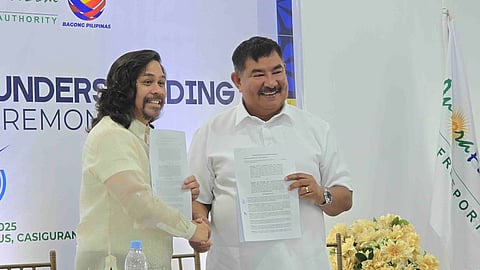 (FILES) Aurora Pacific Economic Zone and Freeport Authority President and CEO Gil Taway IV (left) and Bureau of Fisheries and Aquatic Resources Regional Director Wilfredo Cruz (right) lead the ceremonial signing of a partnership to implement inclusive coastal livelihood projects in Casiguran, Aurora. The agreement includes marine-based facilities and technologies aimed at empowering local communities and advancing sustainable fisheries development.