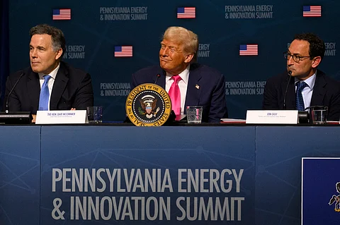 U.S. President Donald Trump (C) looks on during the inaugural Pennsylvania Energy and Innovation Summit at Carnegie Mellon University on July 15, 2025 in Pittsburgh, Pennsylvania.