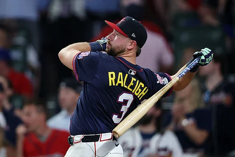 CAL Raleigh of the Seattle Mariners defeats Junior Caminero of Tampa Bay Rays, 18-15, to become the first catcher to win the MLB Home Run Derby.