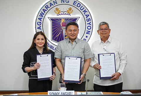 FORGING Stronger Ties for Financial Education: Department of Education Secretary Sonny Angara and BDO Foundation President Mario A. Deriquito share a warm handshake to reaffirm their shared commitment to financial education