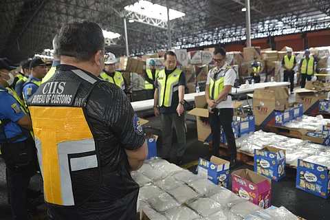 BOC Commissioner Ariel Nepomuceno and personnel of the BOC-Customs Intelligence and Investigation Service inspect the 110.24 kg of methamphetamine hydrochloride (shabu) concealed within four boxes, with an estimated value of P749.63 million.