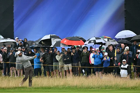World No. 1 Scottie Scheffler watches his shot from the rough on the first hole on the opening day of the 153rd Open Championship at Royal Portrush golf club in Northern Ireland on Thursday.