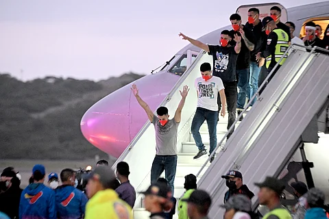 VENEZUELAN migrants who were jailed in El Salvador get off a plane at Simon Bolivar International Airport in Maiquetia, Venezuela on 18 July 2025.