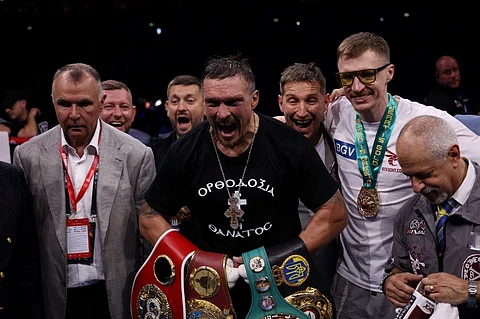Ukraine's Oleksandr Usyk celebrates defeating Britain's Daniel Dubois in their undisputed world heavyweight boxing title bout at Wembley Stadium in London on July 19, 2025.