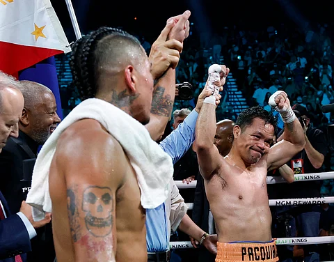 LAS VEGAS, NEVADA - JULY 19: Manny Pacquiao reacts next to Mario Barrios after their WBC welterweight title fight ending in a majority draw at MGM Grand Garden Arena on July 19, 2025 in Las Vegas, Nevada