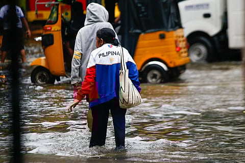 A gutter-deep flood swamps the corner of Taft Avenue and United Nations Avenue in Manila at 9:26 a.m. on Monday, 21 July, as authorities monitor a new low-pressure area within the Philippine Area of Responsibility.