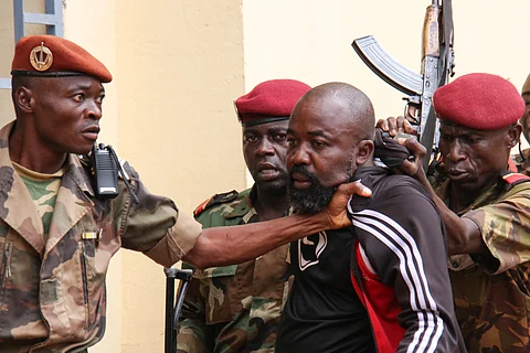 Members of the armed forces arrest Central African MP Alfred Yekatom aka "Rambo" (C), who represents the southern M'baiki district former militia leader, after he fired the gun at the parliament in Bangui on October 29, 2018. A lawmaker fired into the air in the Central African Republic's parliament on October 29, 2018 after an altercation with a colleague as MPs prepared to vote for a new speaker.