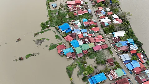 Floodwaters due to the storms and the southwest monsoon almost submerged villages in Calumpit, Bulacan on Friday morning as the river near the area overflowed. Various government agencies and groups have launched relief operations to aid the residents in the villages.