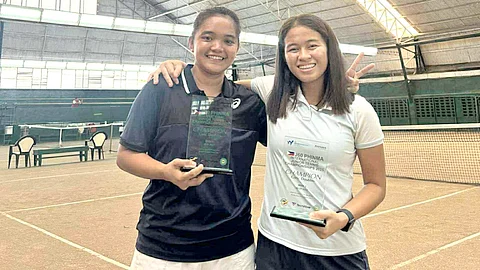 TENNIELLE Madis (left) and Stefi Marithe Aludo celebrate after being crowned as doubles champions in the second leg of the J60 PHINMA-ITF Junior Championships at the Manila Polo Club in Makati City on Sunday.